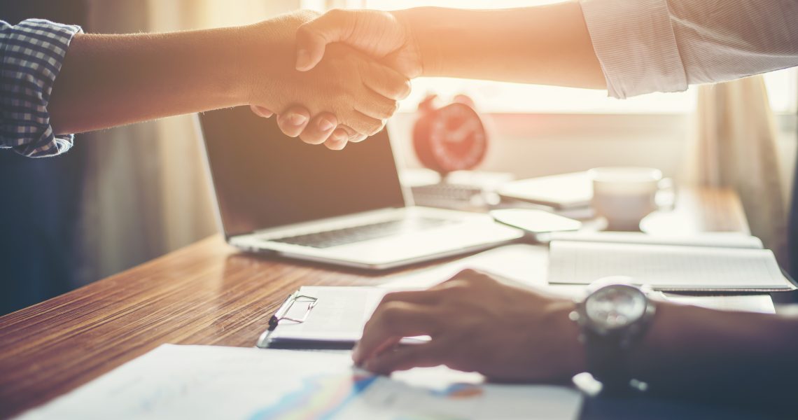 Business People Handshake Greeting Deal at work.